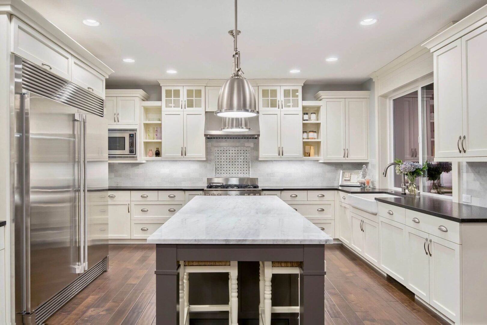 Beautiful Kitchen in Luxury Home with Island and Stainless Steel